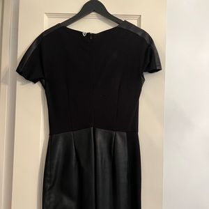 Twin Set women’s black short sleeve dress with leather bottom. Size M